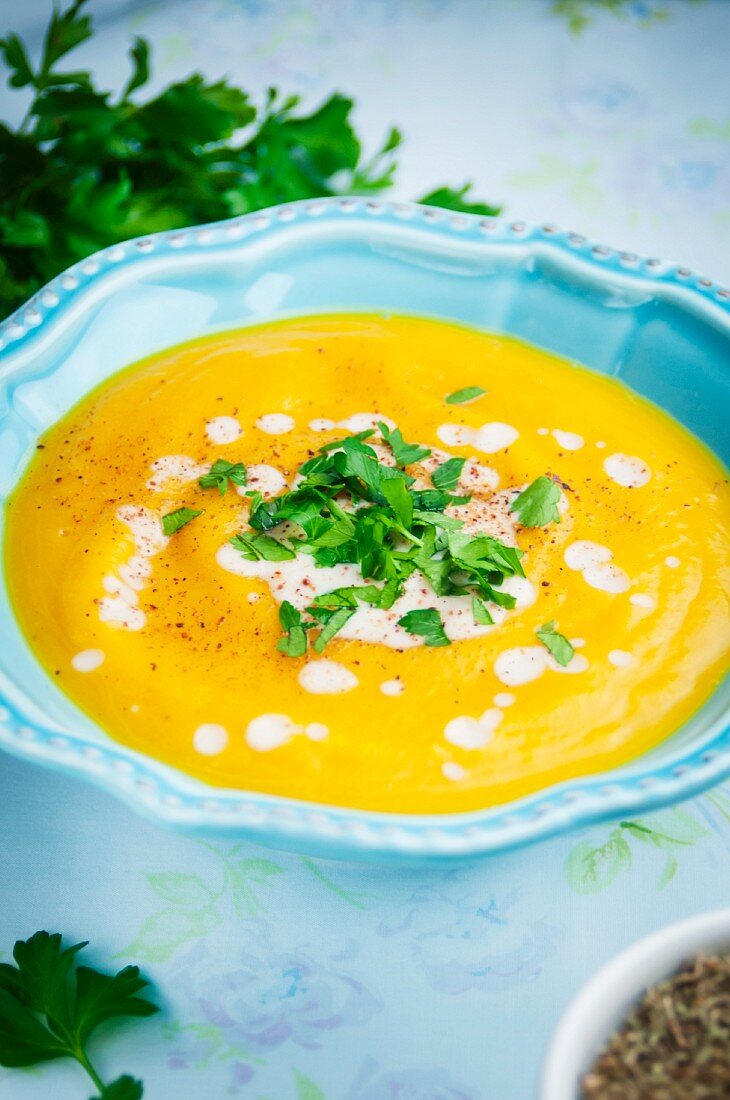 Butternut squash soup garnished with parsley