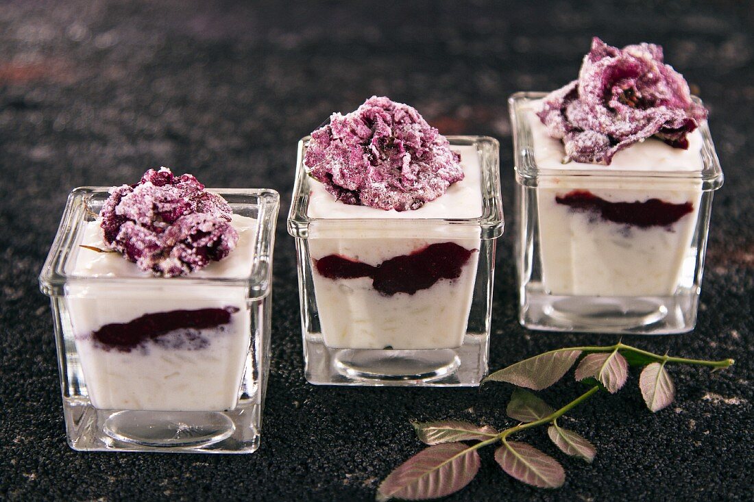 Rice pudding with blueberries and candid rose petals