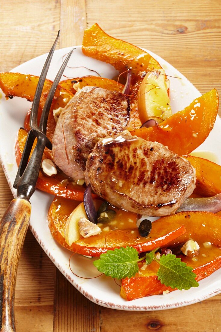Young wild boar steaks with an apple and pumpkin medley