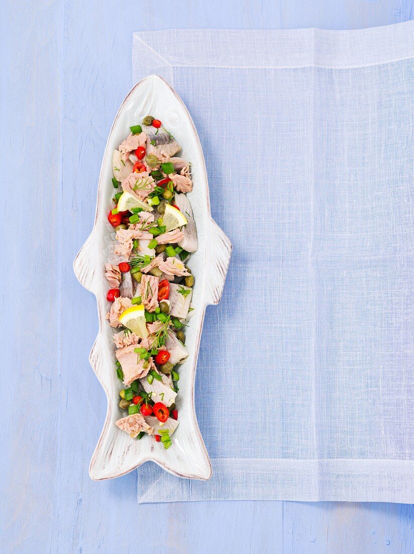 Herring and tuna salad with capers, chilli and spring onions