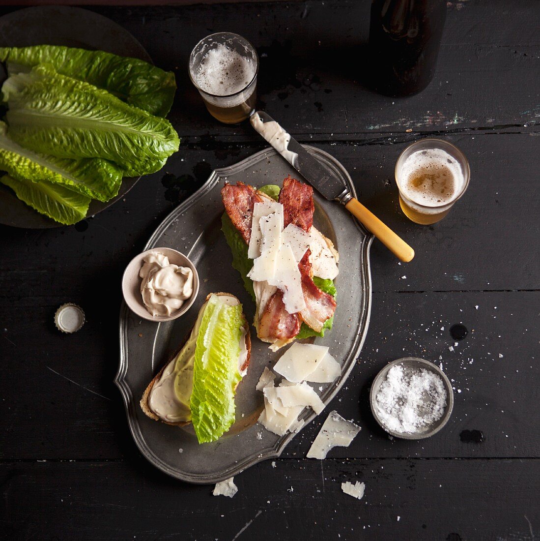 A club sandwich with lettuce, bacon and Parmesan