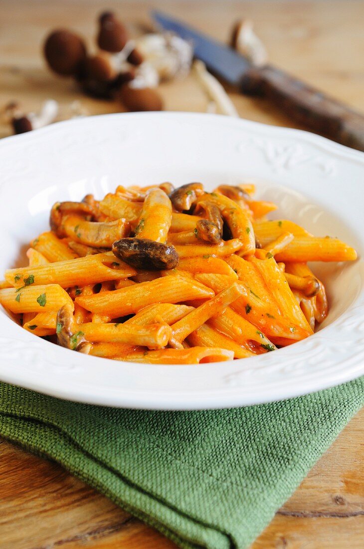 Penne with wild mushrooms and a creamy tomato sauce