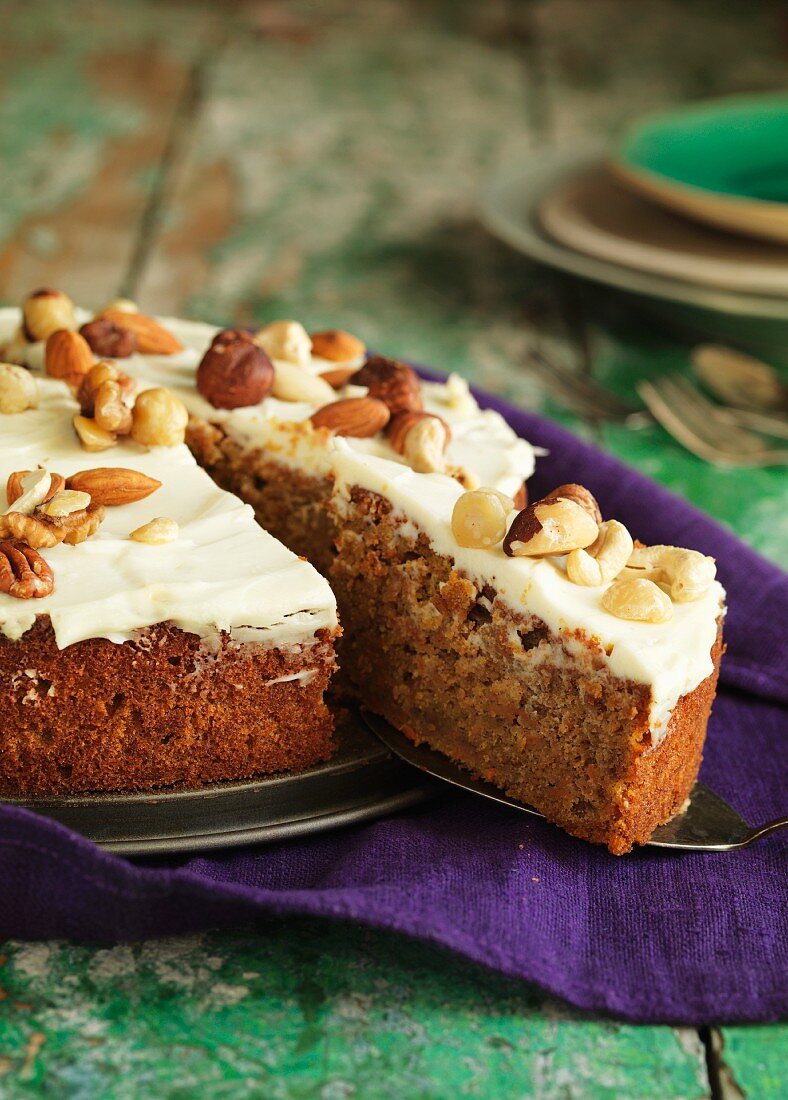 Carrot cake with lemon and nuts, sliced