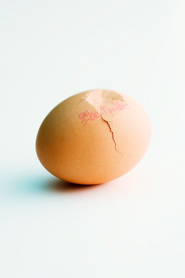 A cracked egg with a stamp of origin