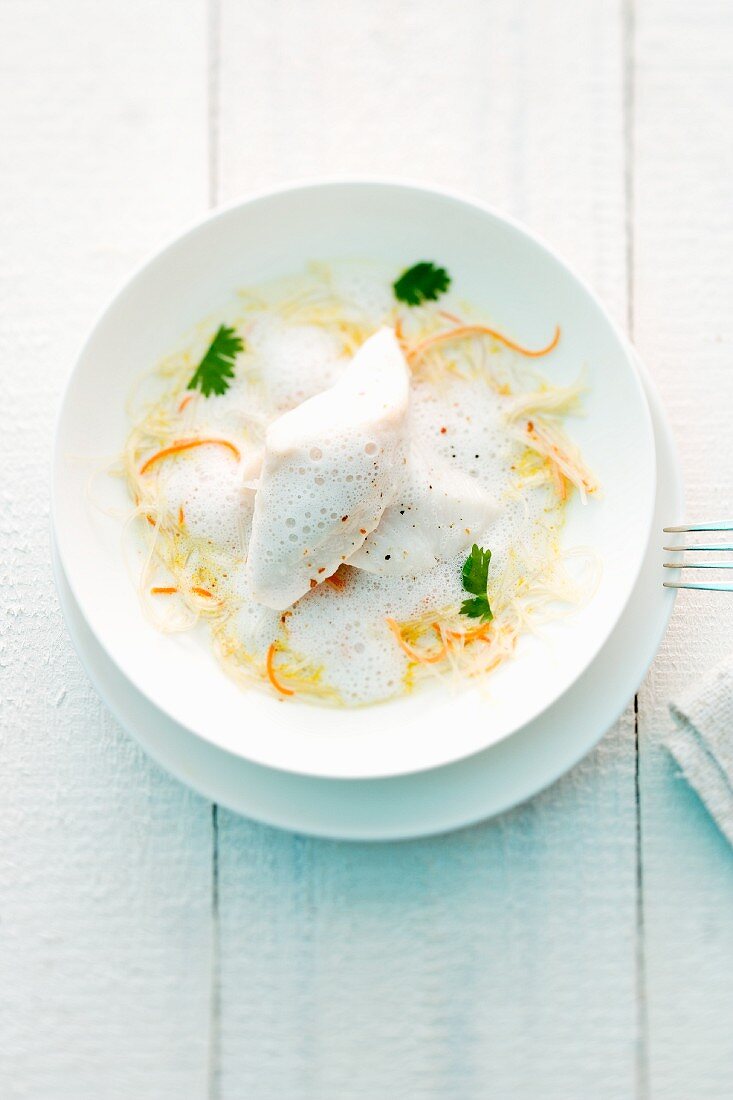 Poached John Dory on a bed of glass noodles with coconut sauce