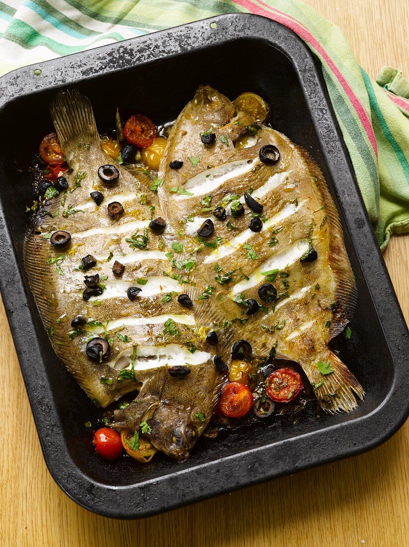 Fried lemon sole with olives and cherry tomatoes