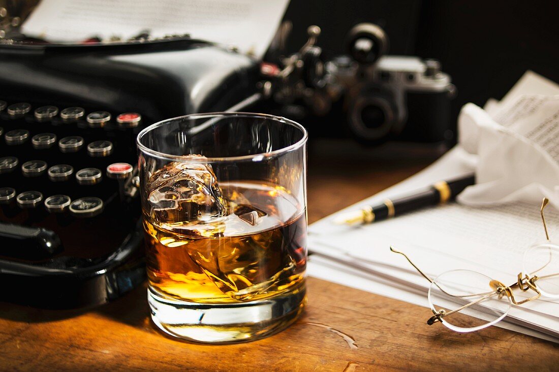 A glass of Scotch on a desk