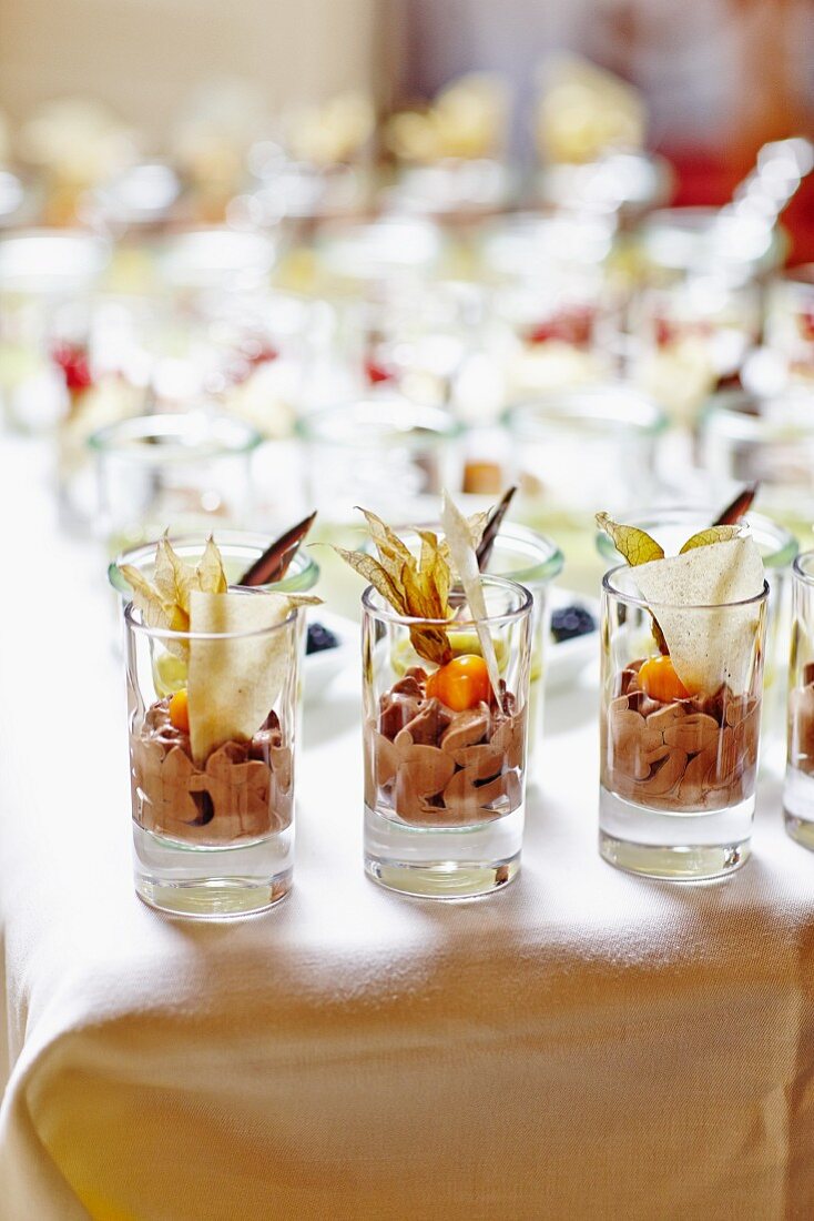 Chocolate cream garnished with physalis on a buffet