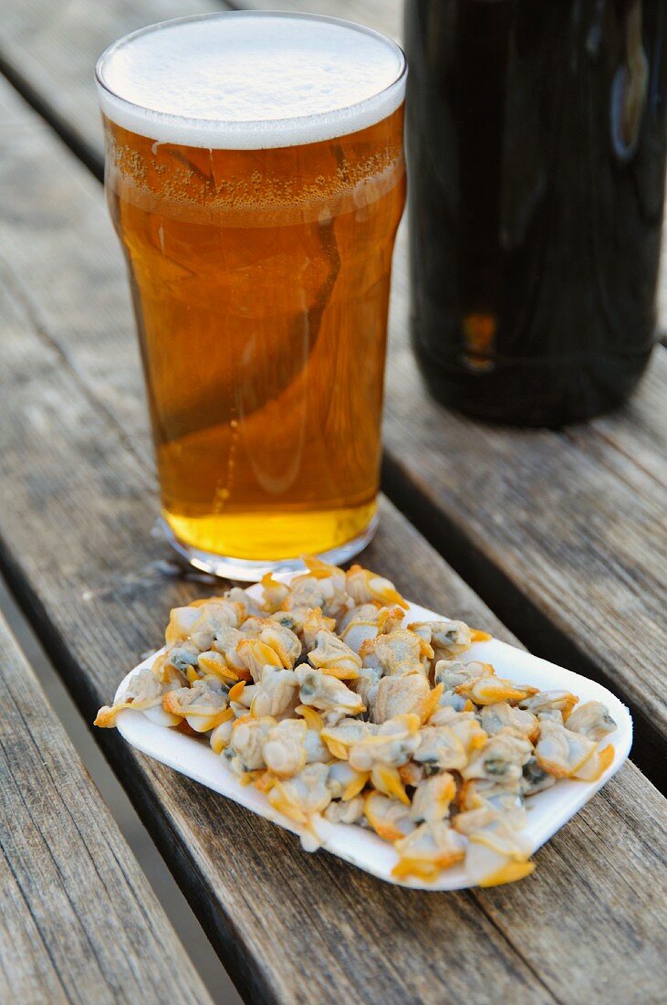 Mussels and beer on a wooden table