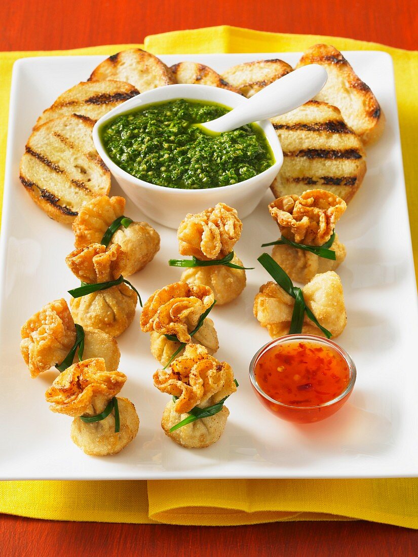 Fried pancake sacks with chilli sauce, salsa verde and grilled bread