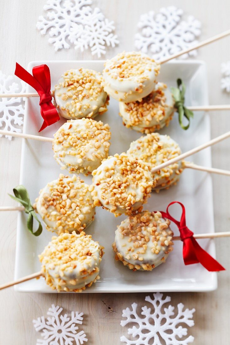 Christmas cake pops decorated with white cooking chocolate and nut brittle