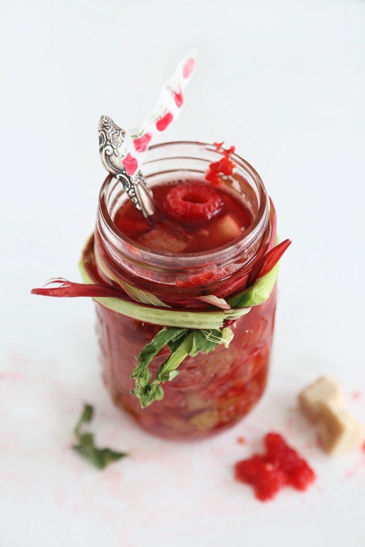 A jar of rhubarb and raspberry compote
