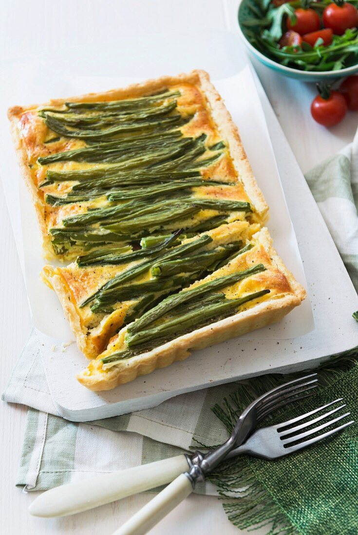 Green bean quiche, partly sliced