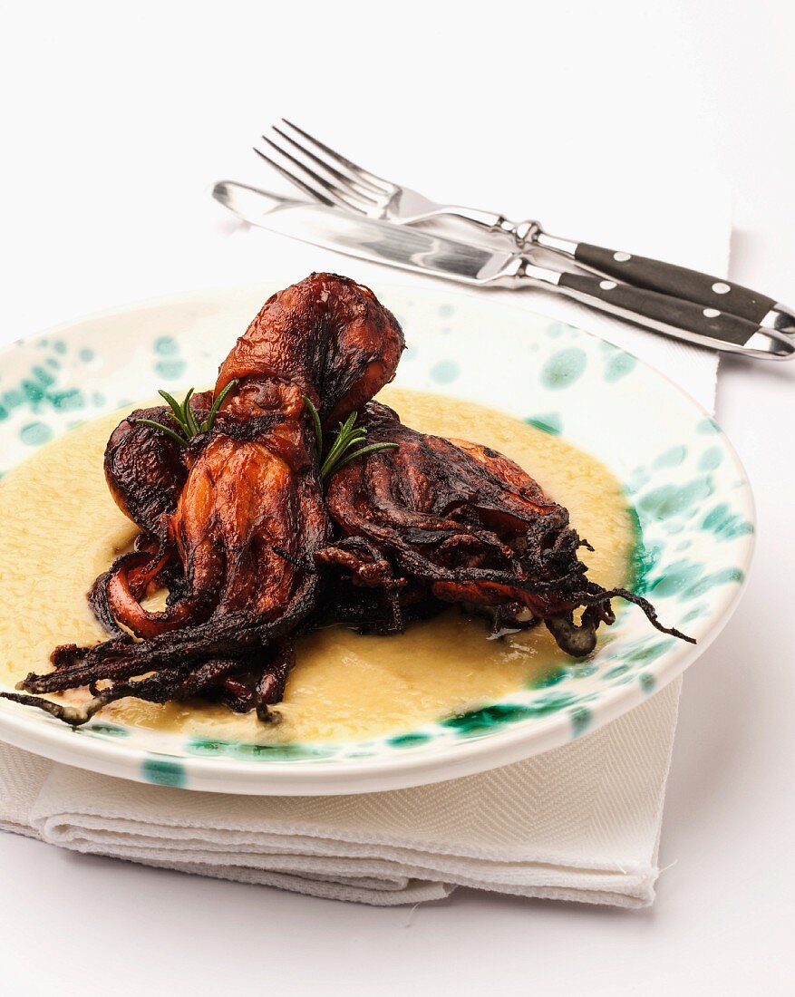 Fried octopus on a bed of creamy polenta
