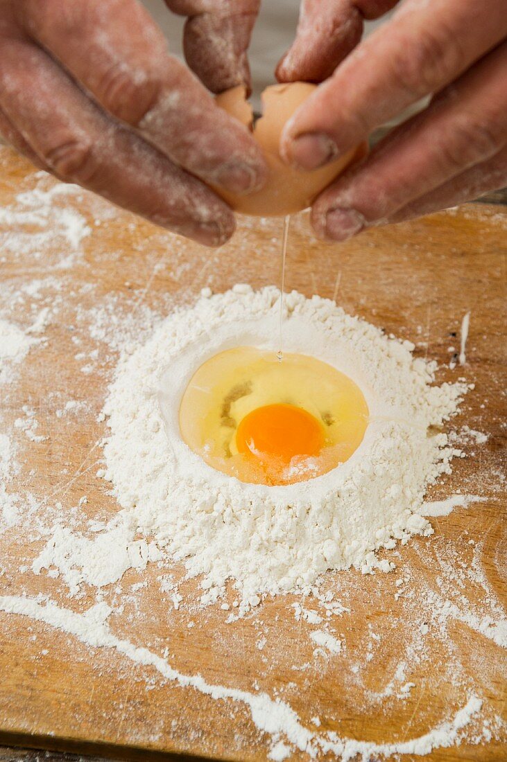 An egg in a pile of flour