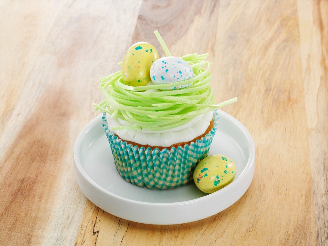 A vanilla cupcake with Easter decorations