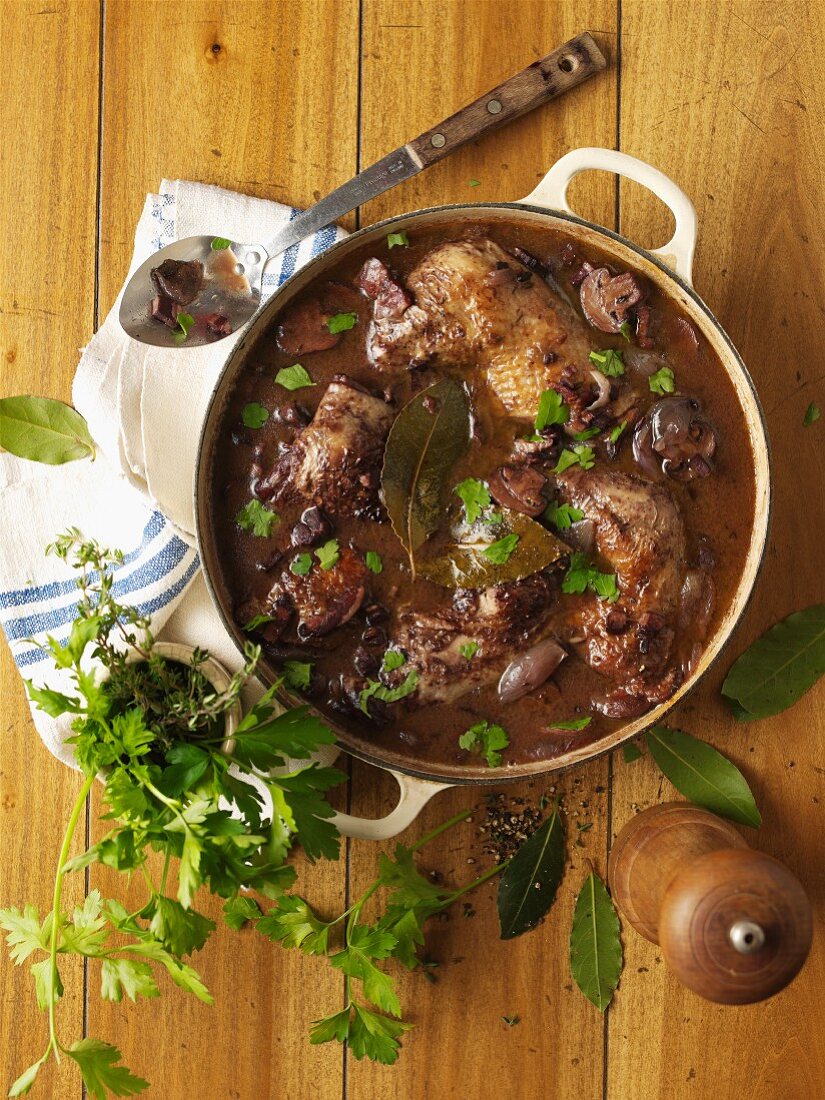 Coq au vin in a casserole pot