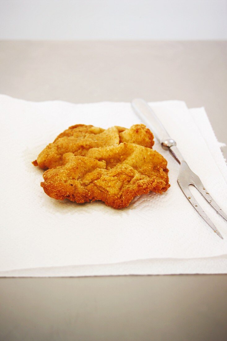 A Vienese escalope on a piece of baking paper