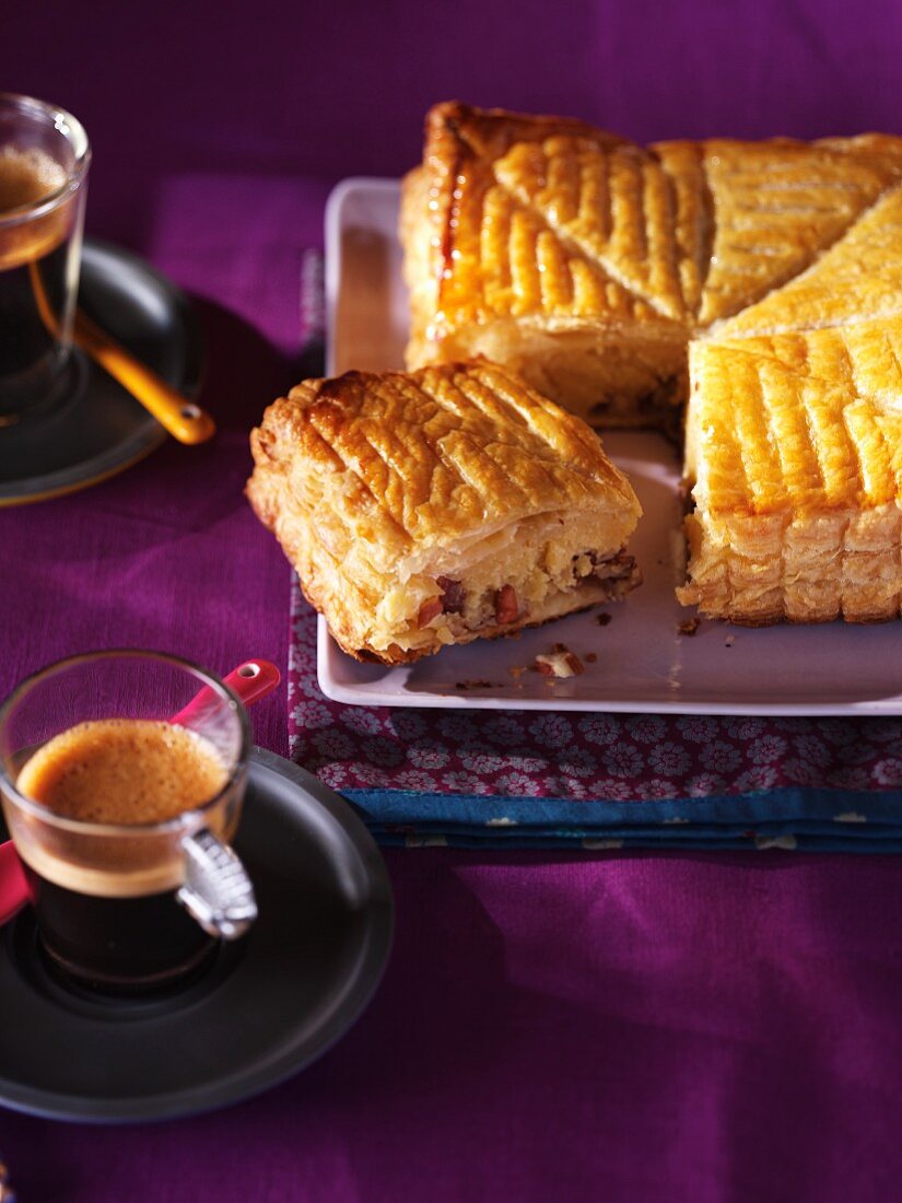 Pecan nut cake and cups of coffee