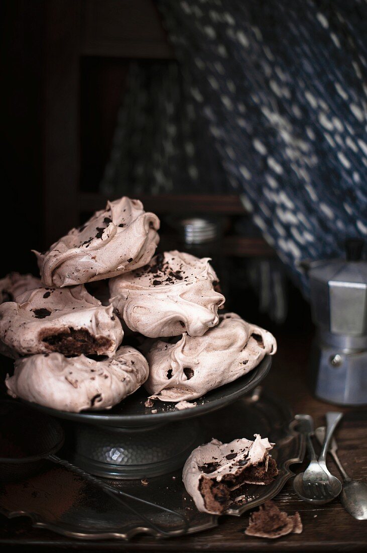 Chocolate meringues on a cake stand