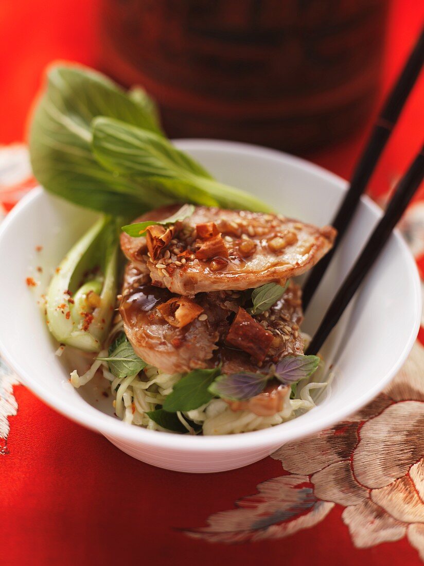 Glazed pork fillet on a bok choy and cabbage salad with mint (Asia)