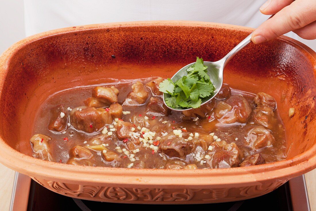 Pork in caramel sauce being made (Vietnam)