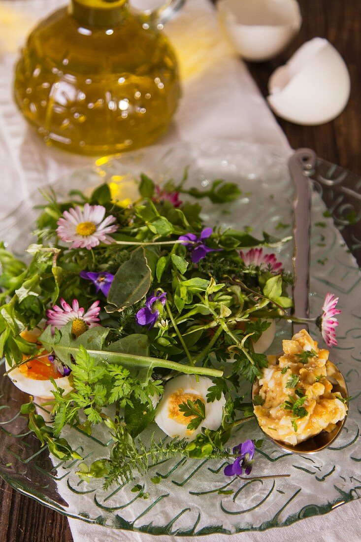 A wild herb salad with daisies and egg