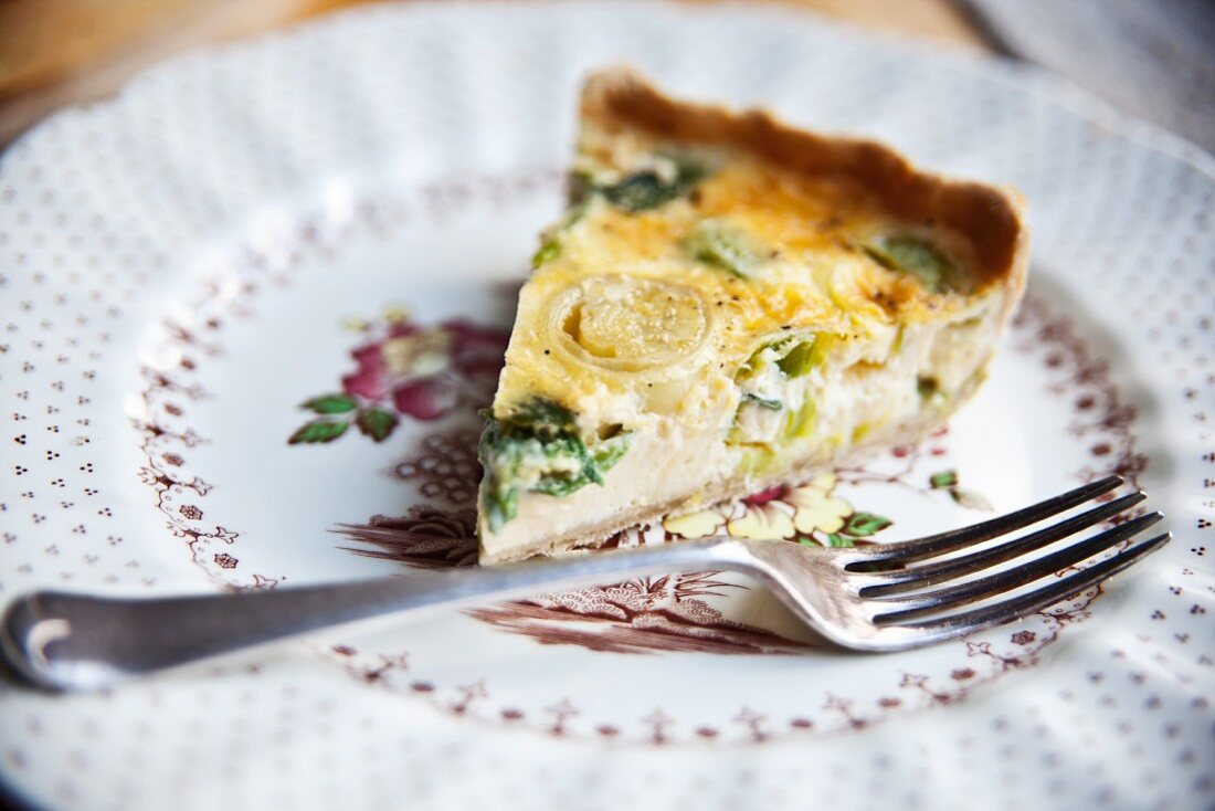 A slice of cheddar and leek quiche