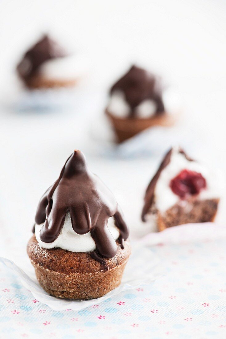 Black Forest Gateau Kisses (chocolate muffins with cherries, a whipped egg white topping and chocolate glaze)