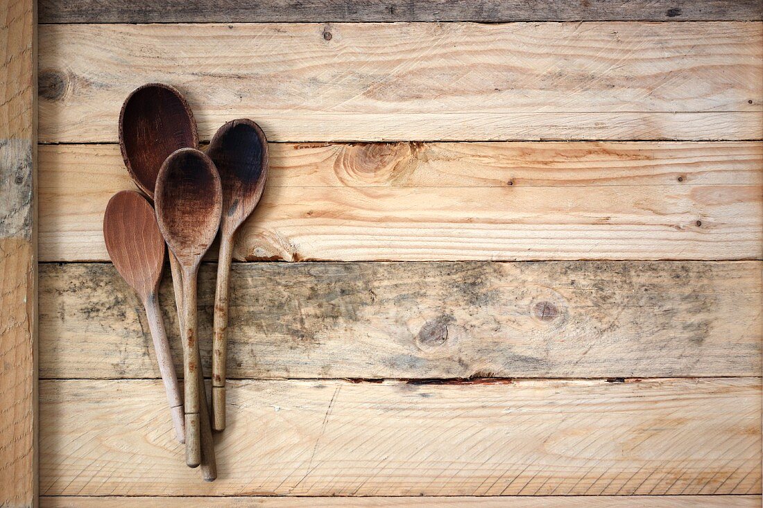 Wooden spoons on a wooden surface