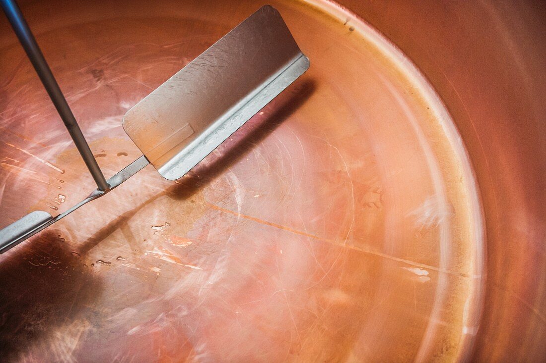 A copper vat in a cheese dairy for making cheese