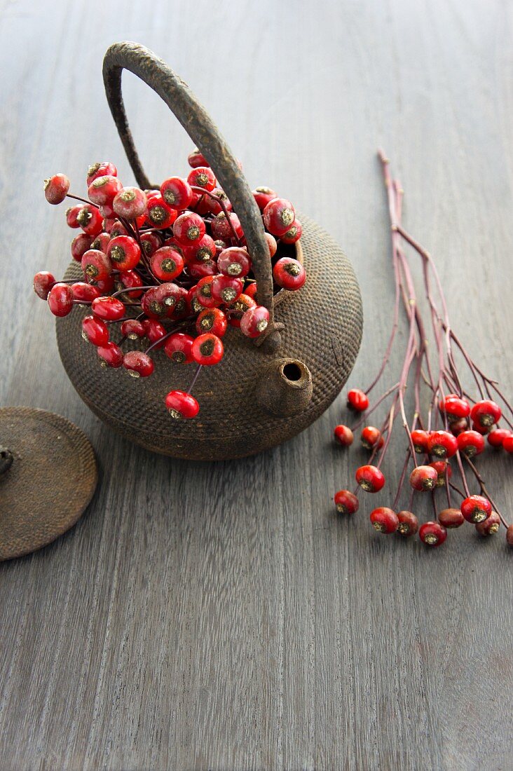 A teapot and rosehips