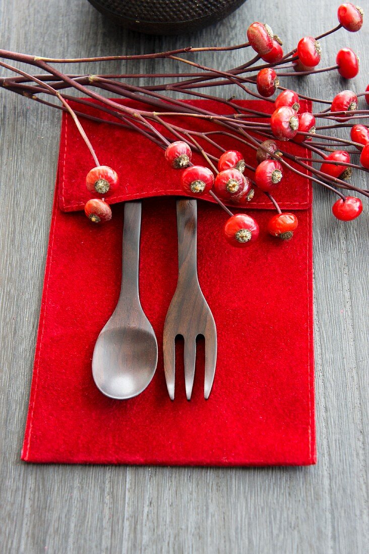 Wooden cutlery and rosehips