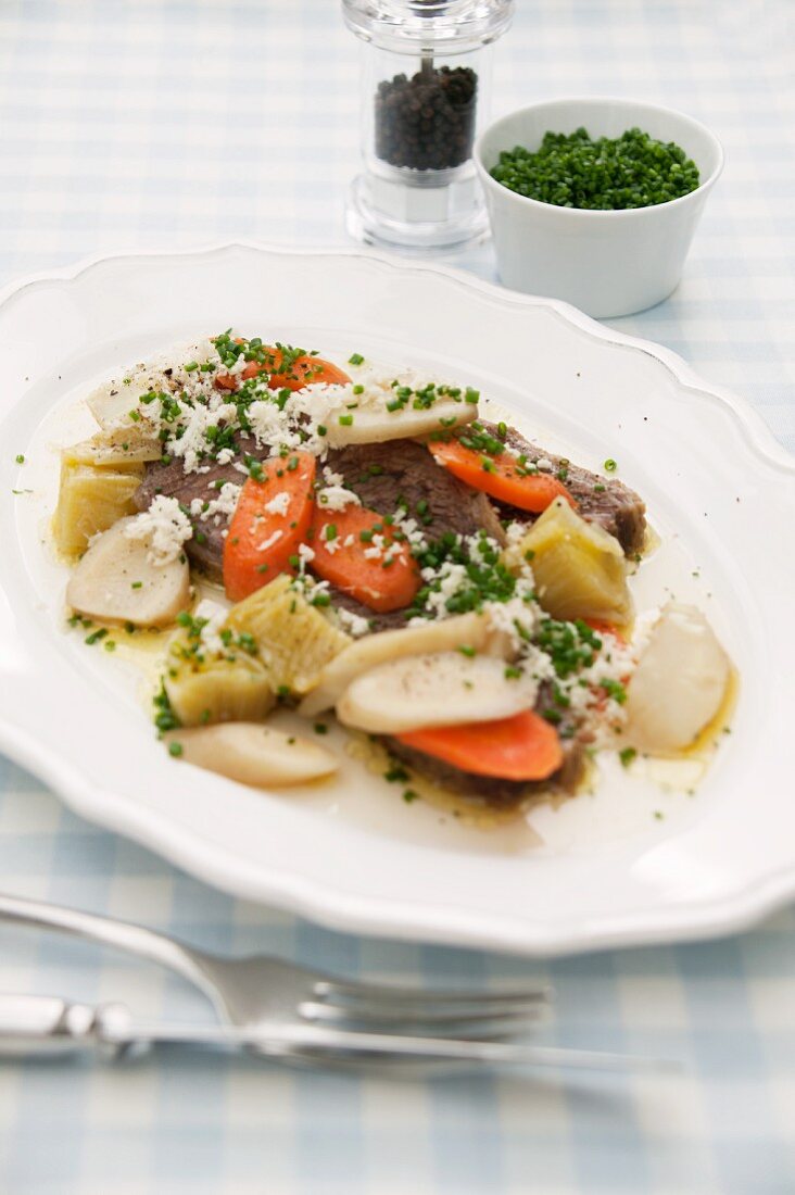 Prime boiled beef with grated horseradish, chives and vegetables