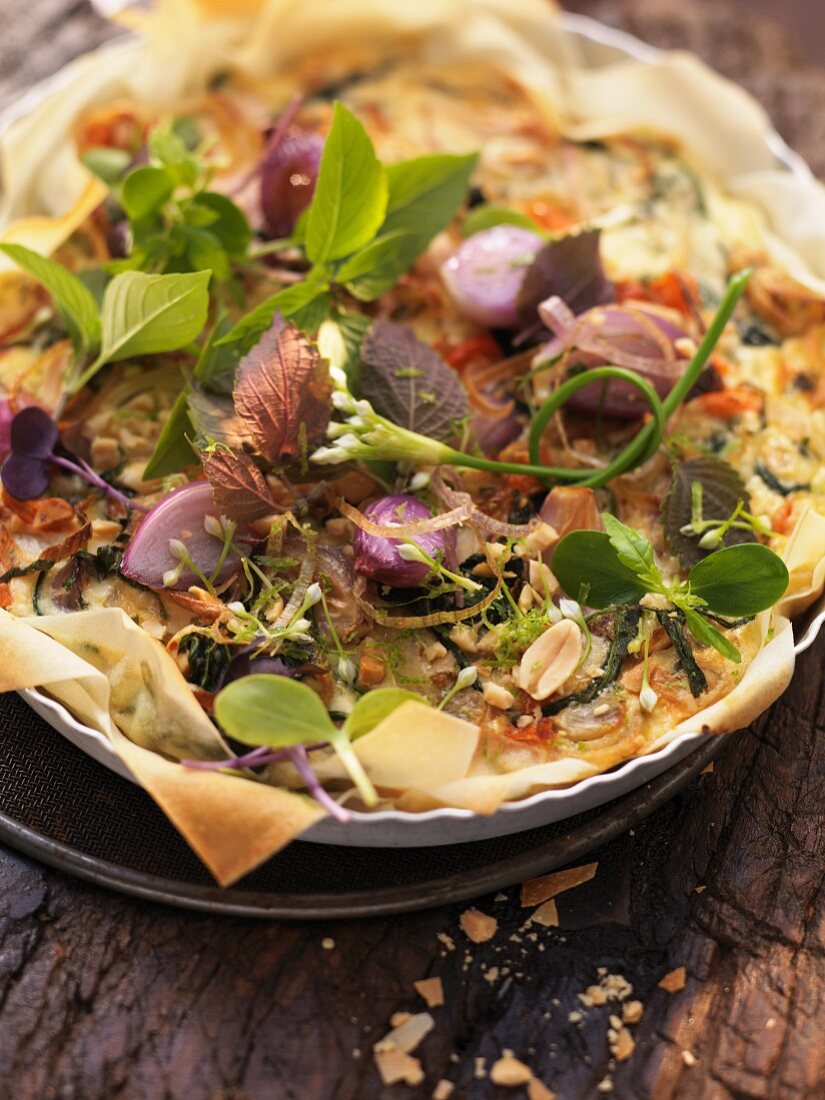 Shallot and pepper tart with a herb salad (Asia)