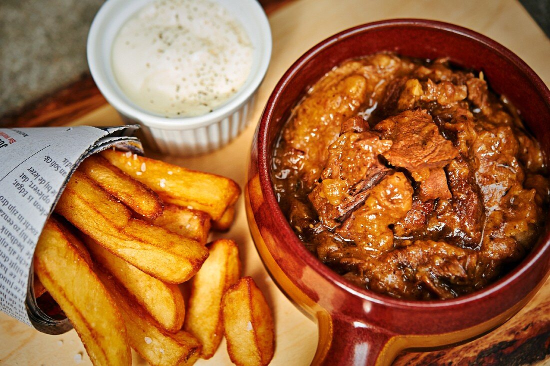 Carbonade flamande (Belgian sweet and sour beef and onion stew made with beer) with chips and mayonnaise