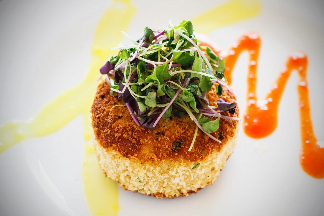 Fried grits cake with fresh cress