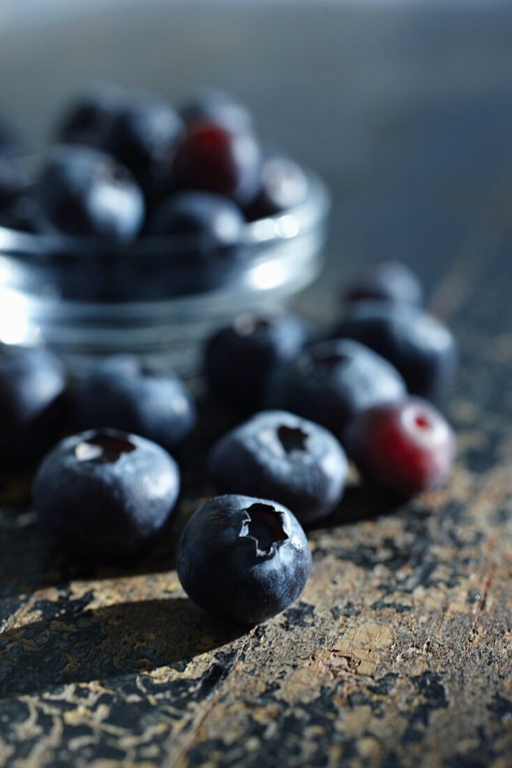 Blueberries on a rustic wooden surface