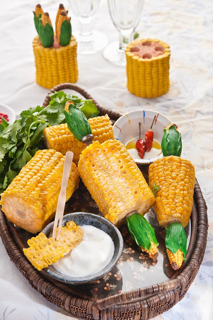 Sweetcorn cobs with sour cream and olive oil