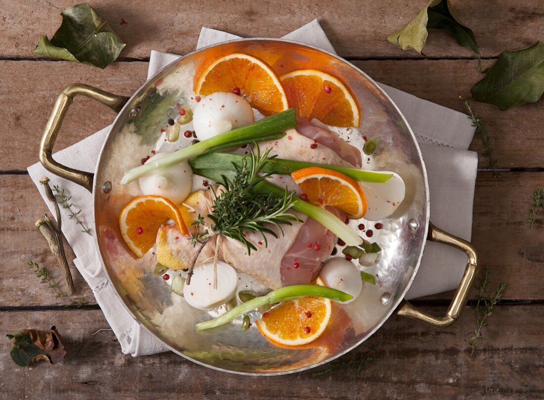 Chicken legs with onions, oranges and herbs