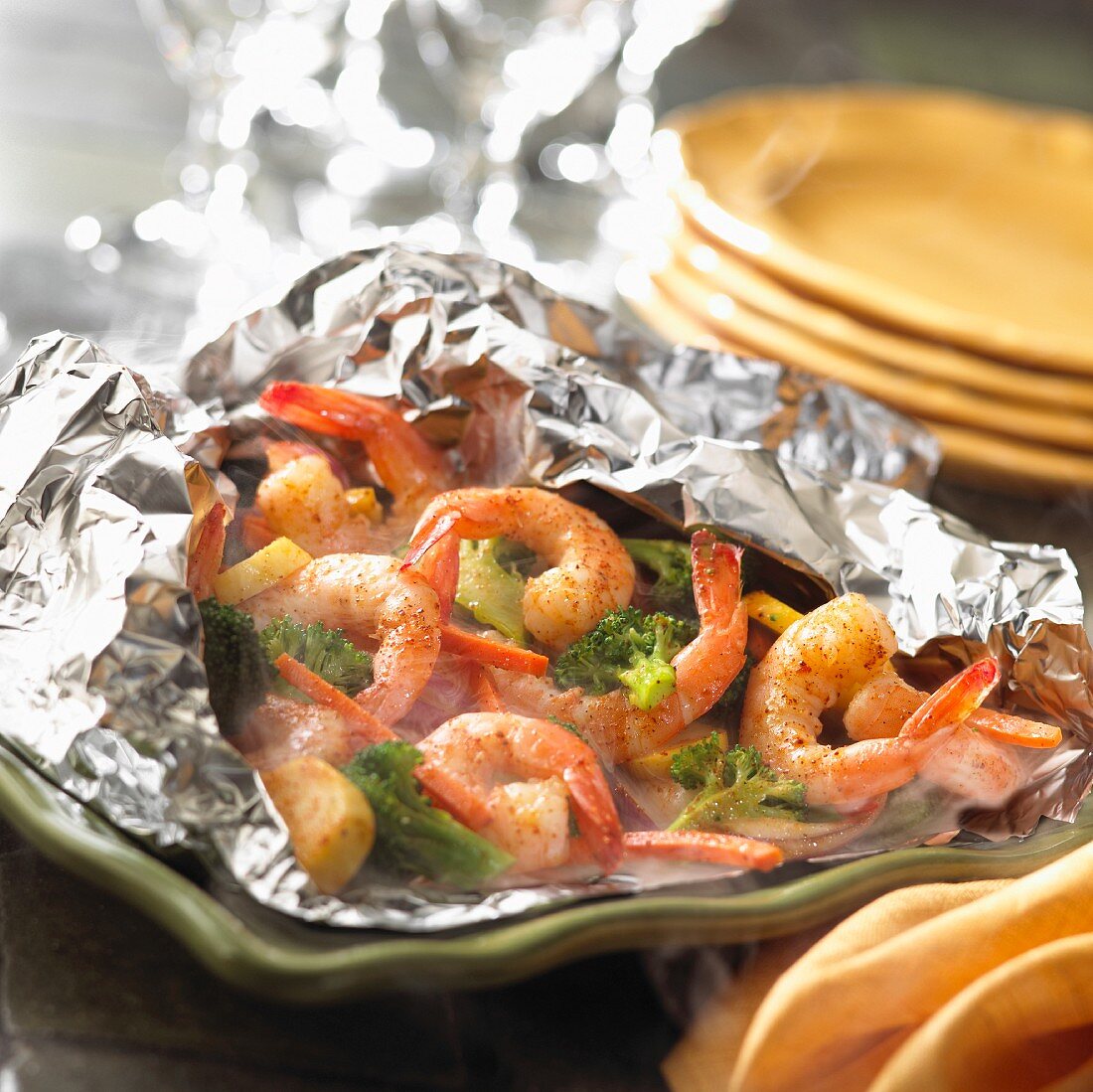 Pranws and broccoli steamed in a foil pouch