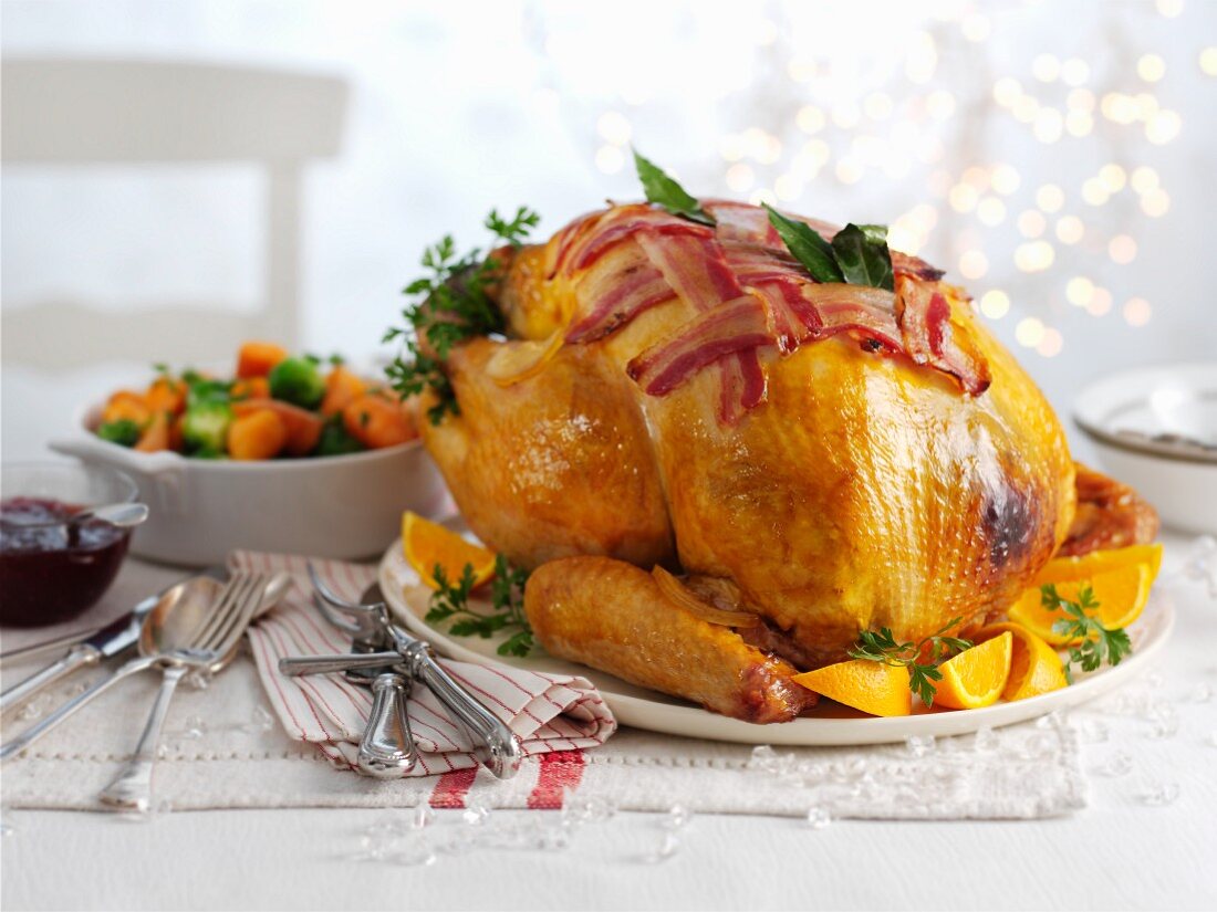 Roast turkey with bacon and oranges for Christmas