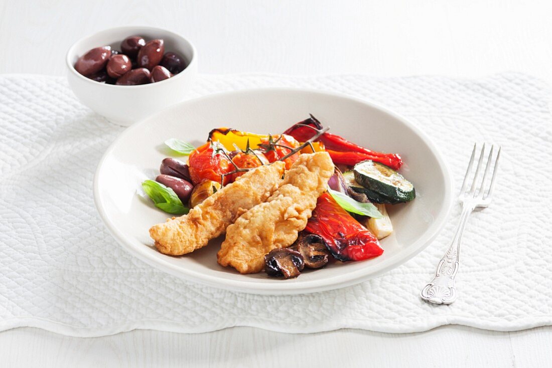 Fried fish fillets with roasted peppers