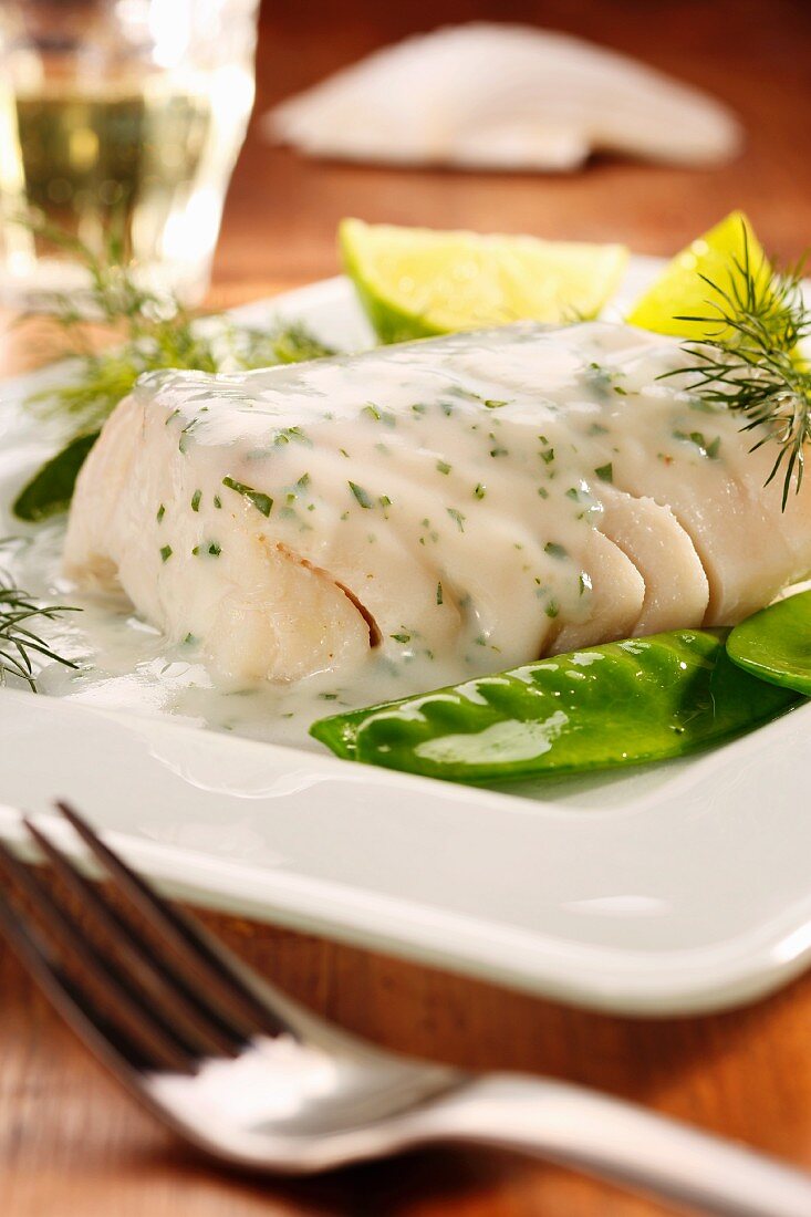 Fish fillet with a dill sauce and mange tout