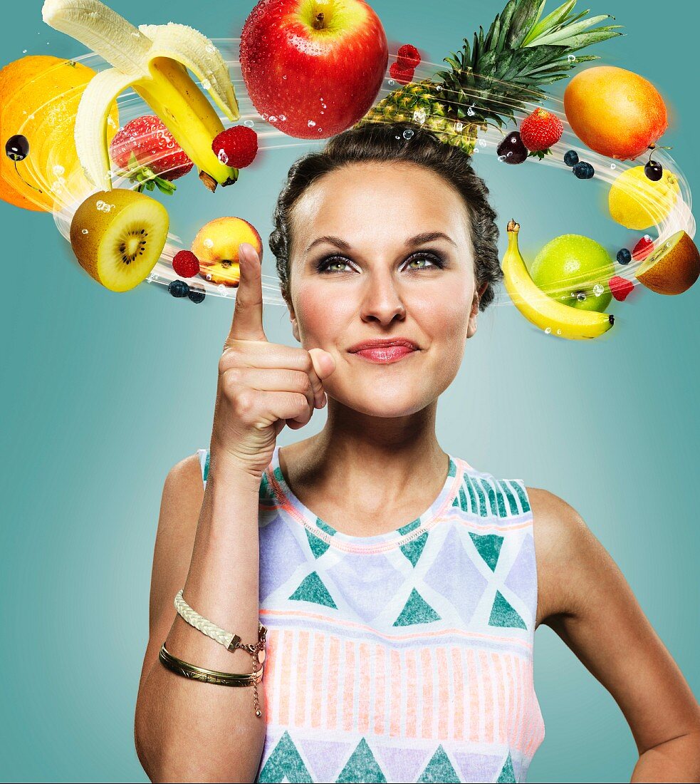 A woman surrounded by flying fruit