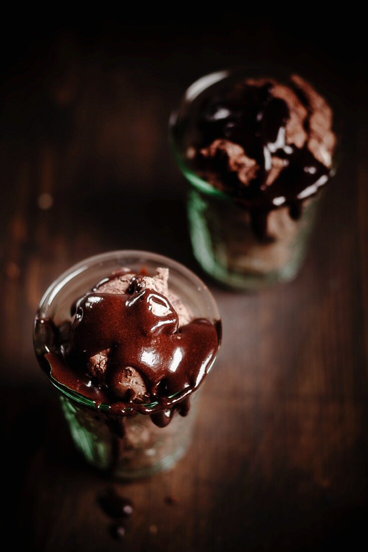 Chocolate ice cream with chocolate sauce in glasses
