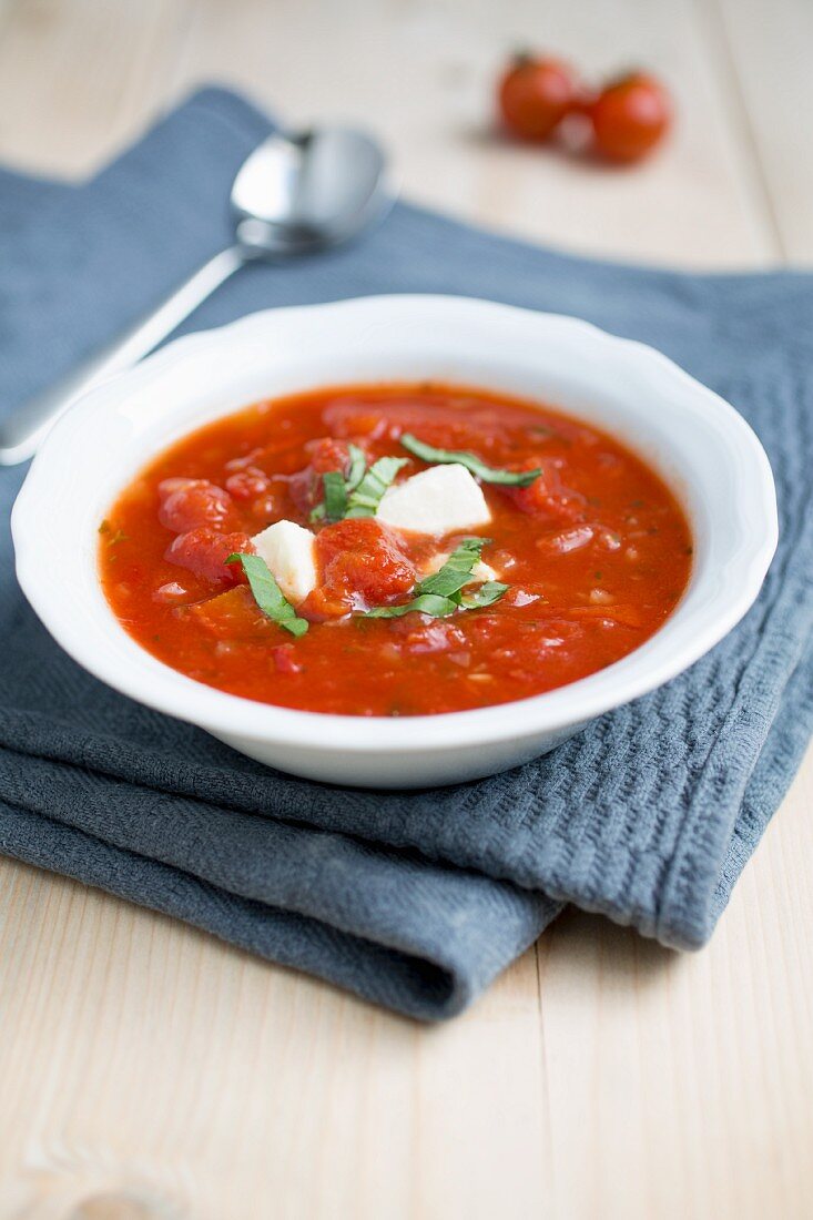 Tomato soup with mozzarella and basil