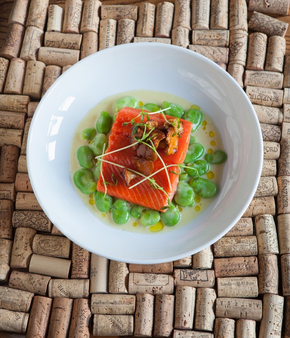 Salmon fillet with chanterelle mushrooms on broad beans