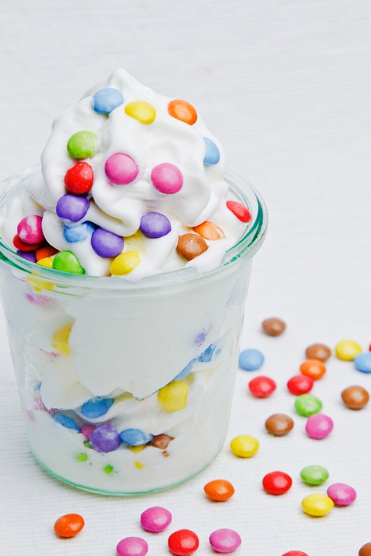 Frozen yogurt with colourful chocolate beans