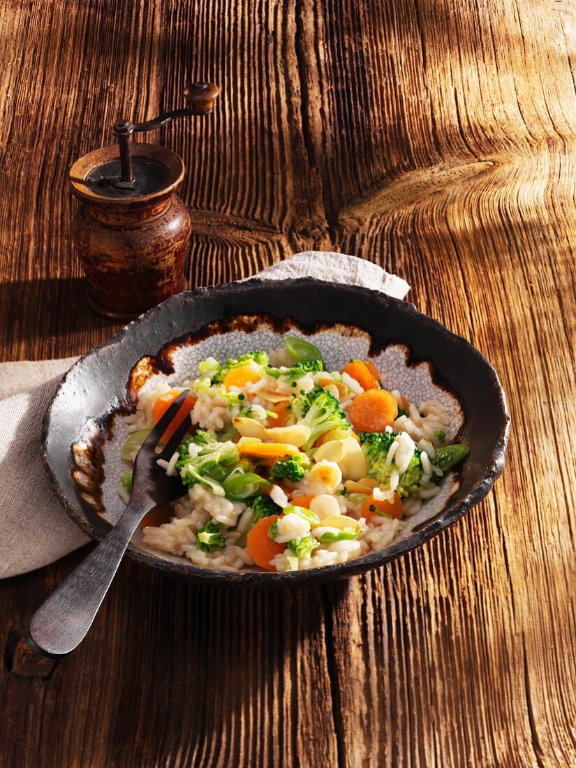 Rice with broccoli, carrots, beer and slivered almonds